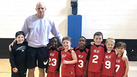 Landon supporting local youth athletes at a PGYA Basketball Game. (L-R) John Henry Meisenheimer, Landon Jackson, Quinshay Muldrew, George Meisenheimer, Nathan Baltimore, Jack Pirtle, William Allen and Braxton Giles.