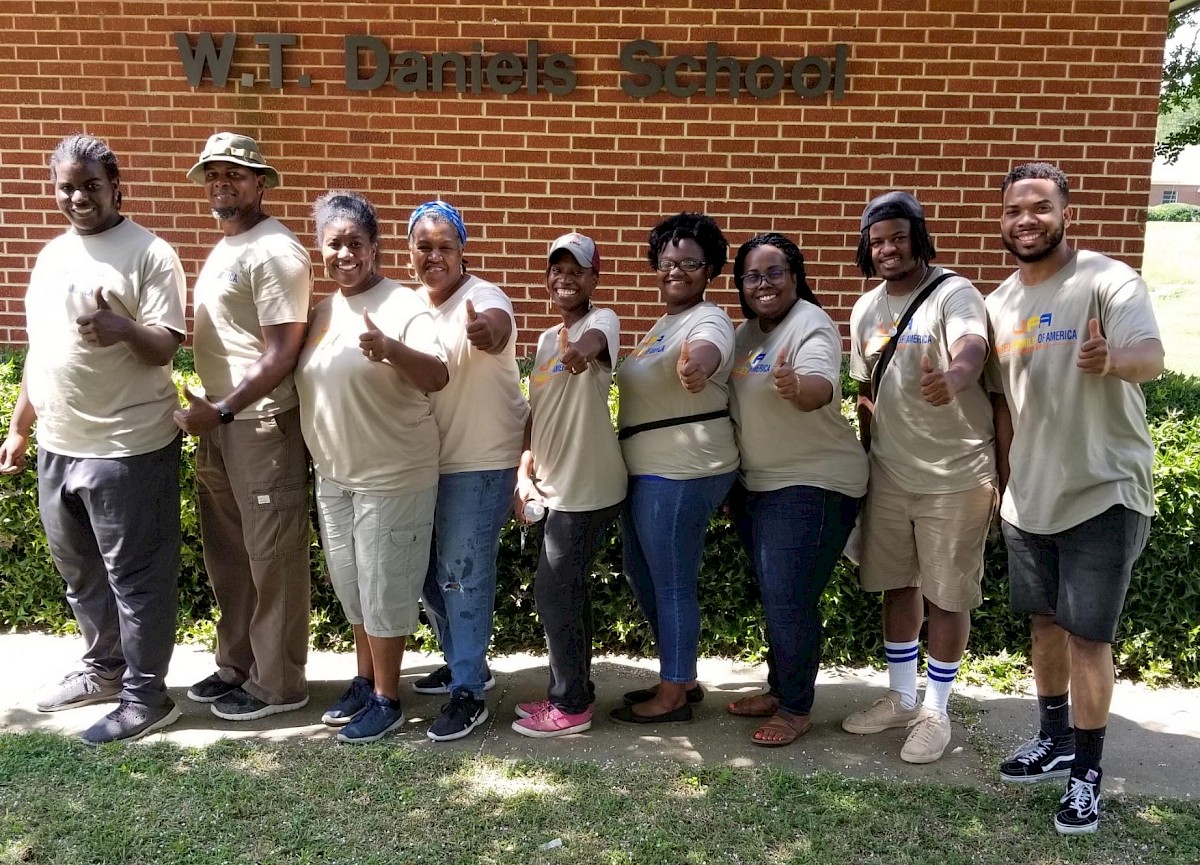 The United Families of America-Arkansas Foodbank staff at the W.T. Daniels Center where the program began.