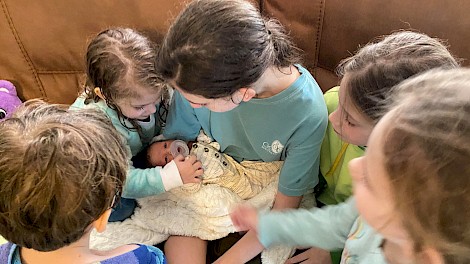 The Francis kids meeting their new baby brother.