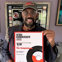 Dr. Otis Williams in his home, holding his certificate from the Library of Congress National Recording Registry for the #1 Chart Hit, “My Girl.”   PHOTO BY Derrick Porter