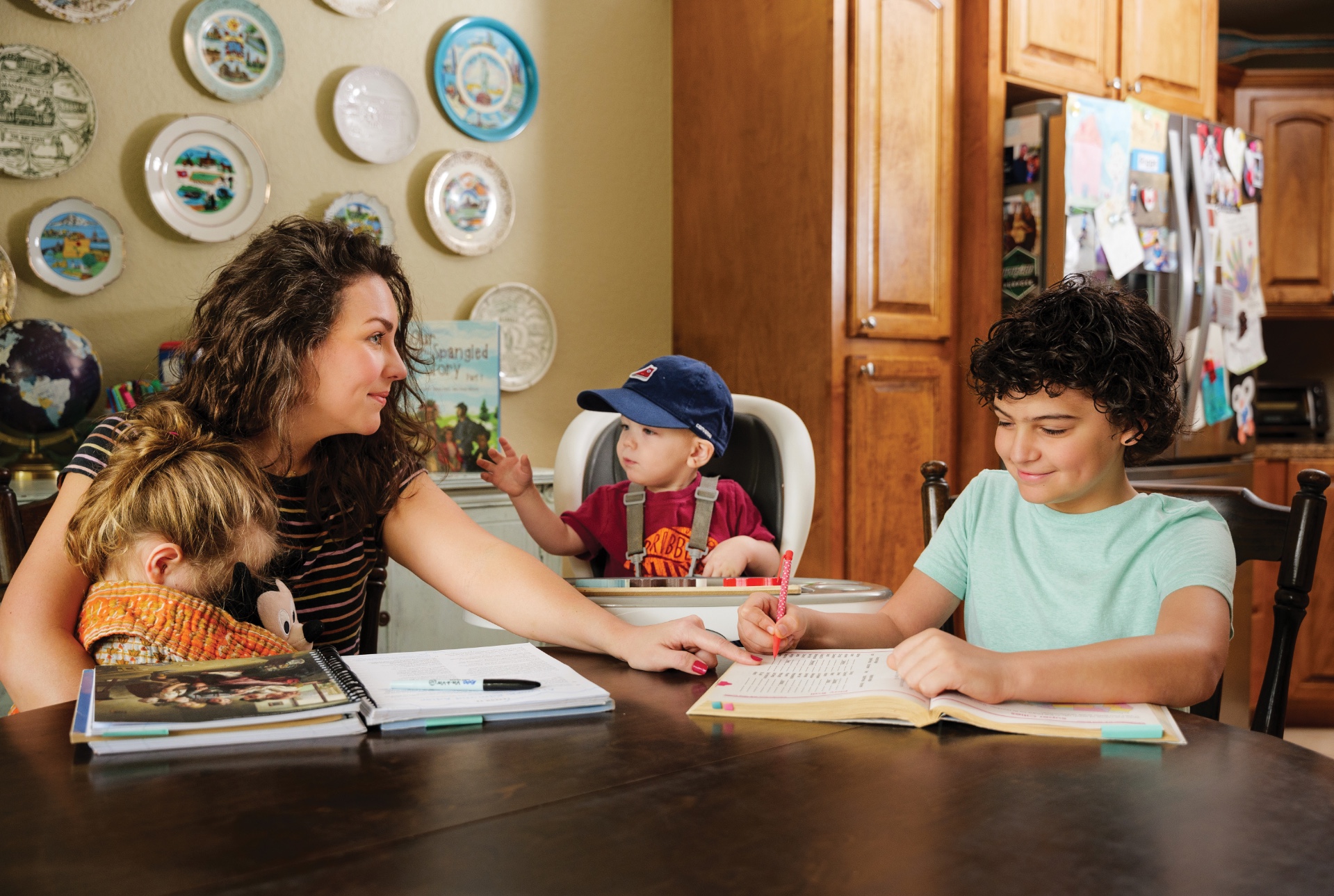 Hope Aubrey teaching her children at home, around the dining room table.  photo by Matt Cornelius