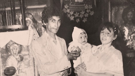 Maria with her parents at a baptism in a local Romanian church.