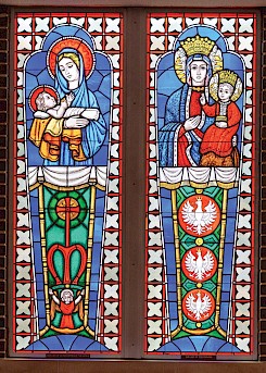 Stained-glass depictions of the Blessed Virgin Mary illuminate the church. Photo by Matt Cornelious