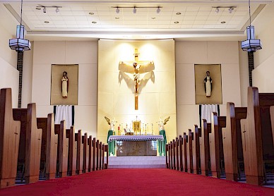 The sanctuary of Sacred Heart in Texarkana, Texas, features a crucifix above the altar, a powerful symbol of sacrifice and redemption. The richly adorned altar stands as the heart of worship, inviting prayer and reflection. Photo by Matt Cornelious