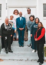 Reverend Larry Ross stands with members of St. James AME on the  steps of their current location at  938 Ash Street, Texarkana, Arkansas. Photo by Matt Cornelious