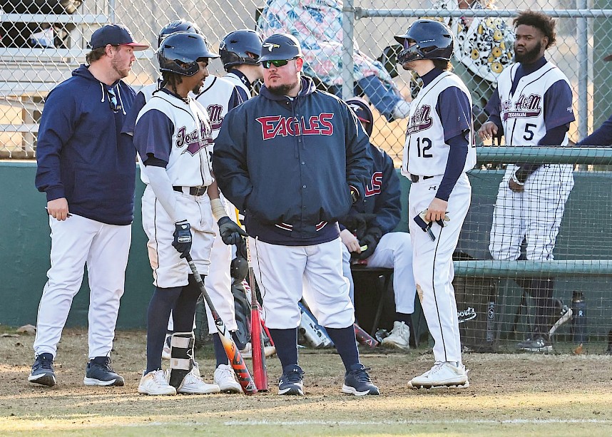 Chase Brewster coaches Eagles baseball players Jose Parreno and Jason Armendariz. Photo by John Bunch