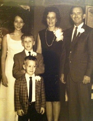 Grissom, the middle child, with his parents, Martha and Elvis Grissom, and two siblings. His family fostered his deep love for music.