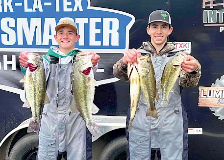 Zaydin Wooten and Jaxon Thomas with one of their many limits at a Ark-La-Tex Bassmaster Tournament. Photo by Lisa Cook Photography
