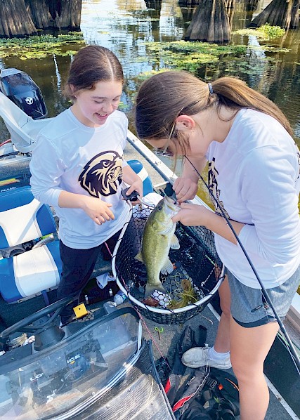  Fiona and Ivy Meadows—Pleasant Grove’s first female fishing team, joined the organization for the love of the sport. Photo courtesy of PGISD