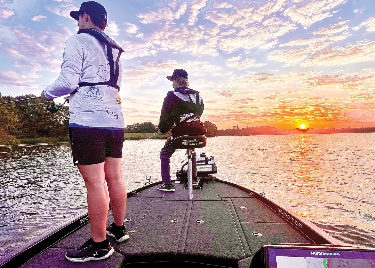 Noah Brown and Bradley Ferguson enjoy the sunset while fishing for Redwater High School.  photo courtesy of RISD