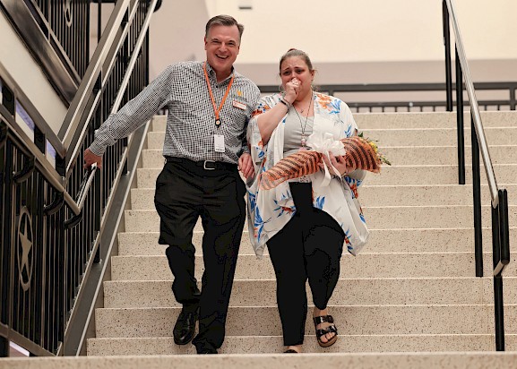 TISD Superintendent Dr. Doug Brubaker congratulates Teacher of the Year Katie Diaz upon receiving her new car. 