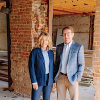 Dr. Brandy Eldridge, director of The Assembly Line, and Rob Sitterley, president and CEO of AR-TX REDI, are pictured at The Assembly Line, currently under construction and scheduled to open in fall 2026, representing the partnership driving the success of REDI…Set…Move. Photo by Matt Cornelius