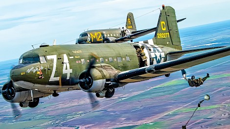 The World War II Airborne Demonstration Team will perform historic-style parachute jumps during the upcoming Texarkana Airshow. photo by Steven Holzinger of Zinger Aviation Media